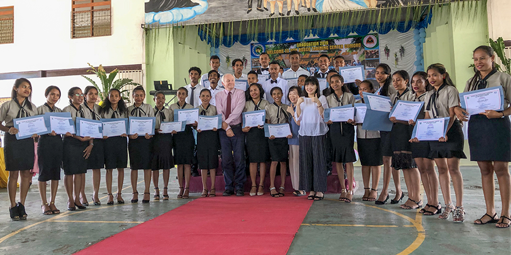 Graduating students show off certificates