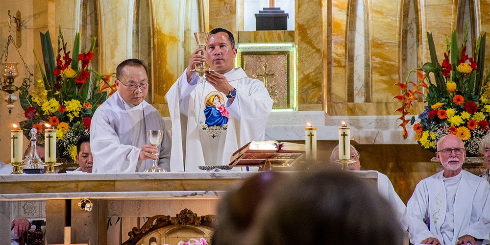 Fr Will Blesses wine