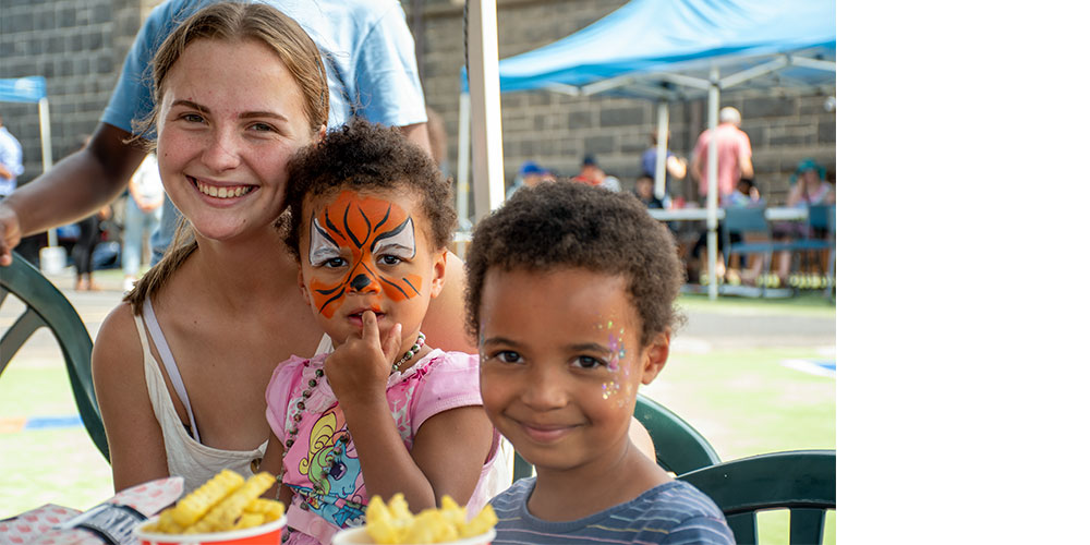 Young people smiling, eating and happy